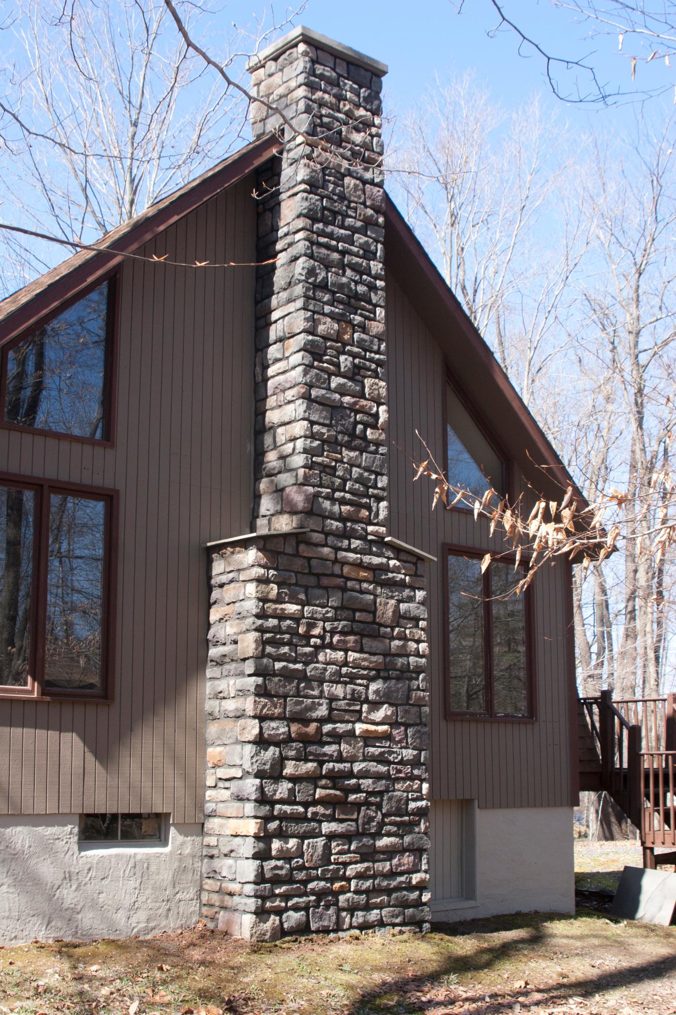 Cut stone chimney, dark mortar